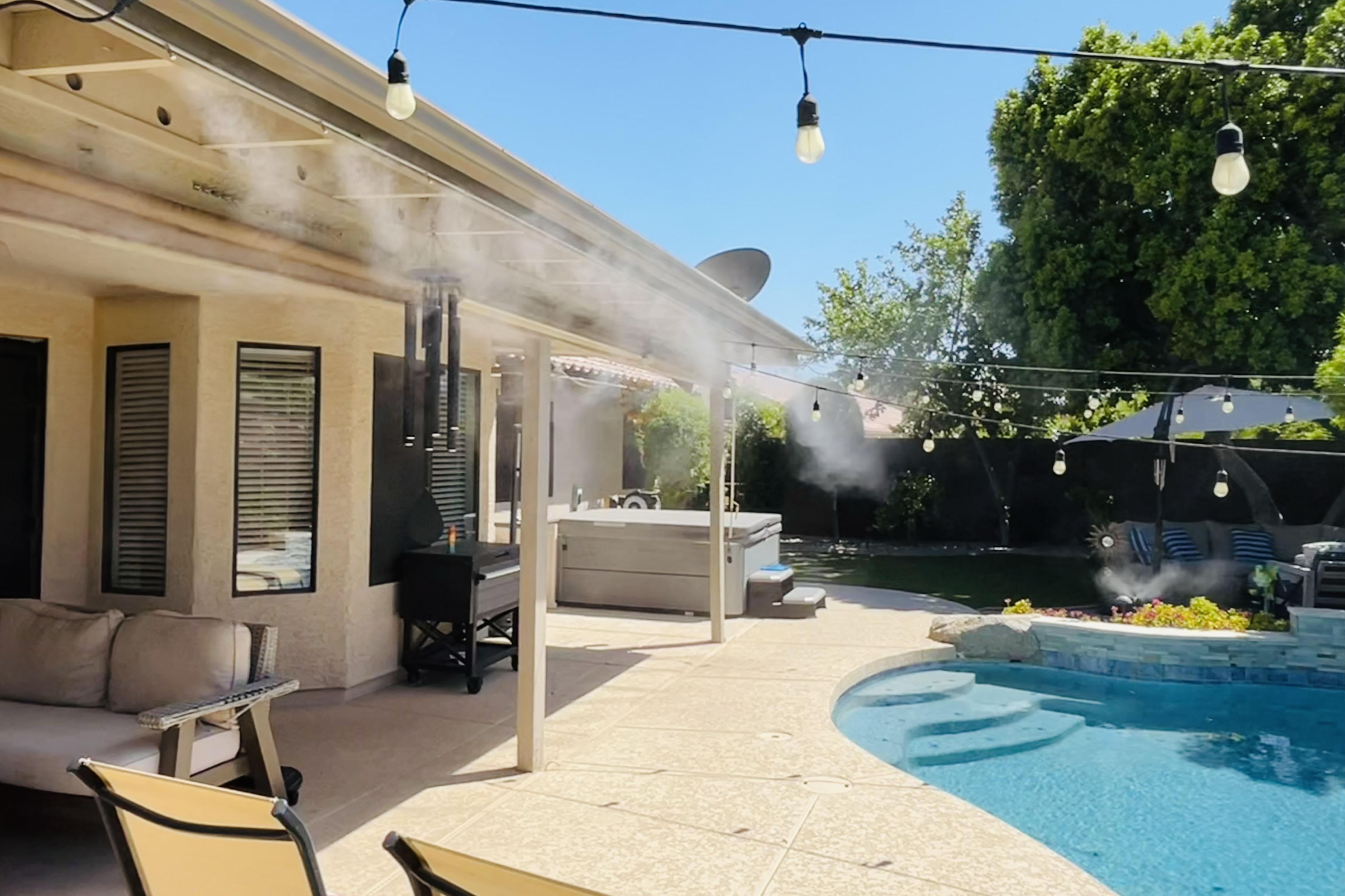 Residential patio misting installation during the day